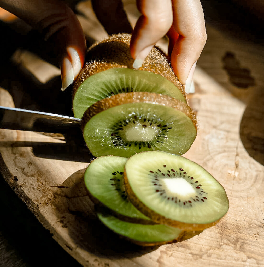 Chopping kiwi fruit